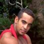 Latino hottie shows his bulging muscles and his erect uncut latino cock.