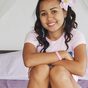 Shy asian teen in pink t-shirt shows little blue panties