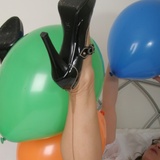 Main in stockings playing with balloons