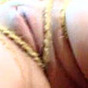 Bondage model posing outdoors, dildoing and giving a few great close-ups of her soaked pussy