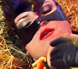 Beautiful cat-woman posing in sexy bondage and flashing her pussy and ass hole on camera