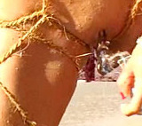 This bondage beauty looks like she came out of the ocean for some sexy beach dildoing