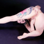 kinky tattooed punk in leather harness