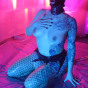 hooded slut in fishnets fucks self with dildo