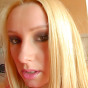 Anita spreads her pink labia and inserts a golden vibrator deep inside