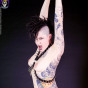 kinky tattooed punk in leather harness