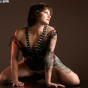 tattooed shaved guerilla girl corset high heels
